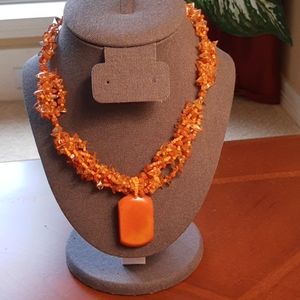 Stunning beaded necklace with large coral stone